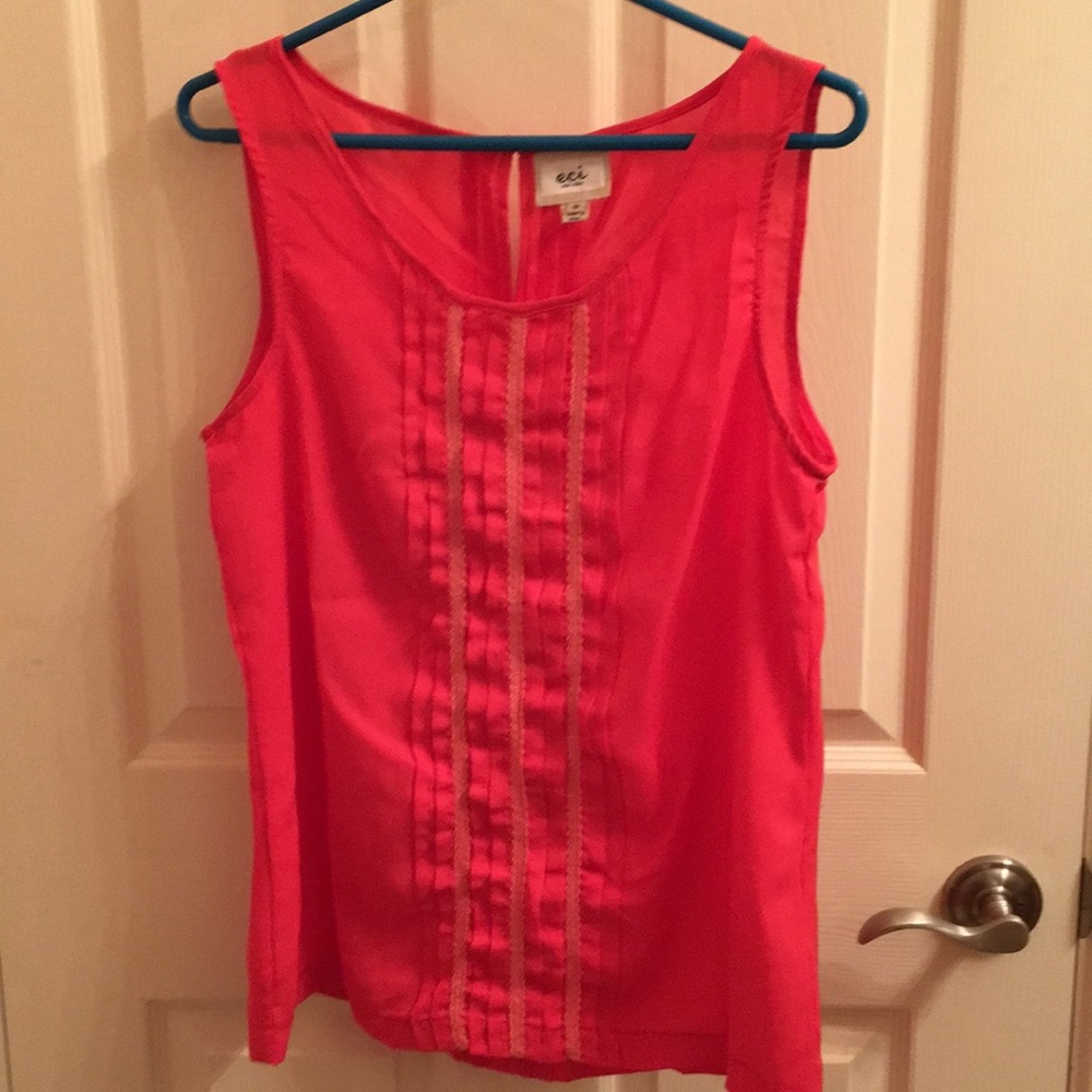 Sleeveless pink ruffle blouse with keyhole back
